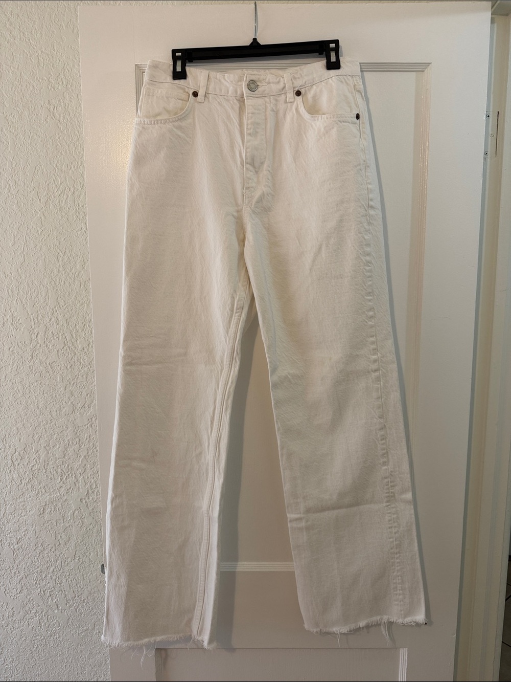 Zara women’s white flare/wide leg jeans.